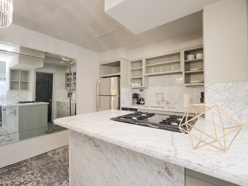 Kitchen with Marble island and counters