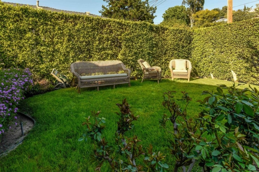 Front yard surrounded by hedges for privacy
