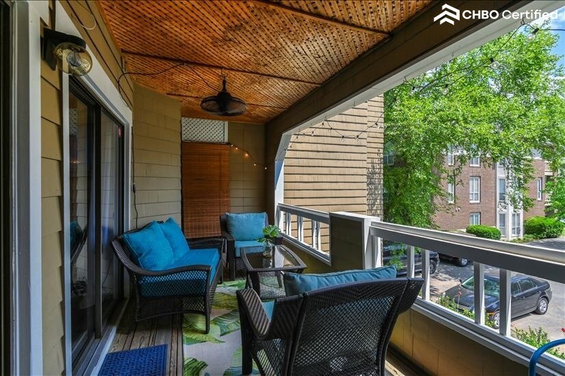 Comfortable patio with fan and bistro lights