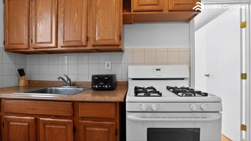 Clean & Functional Kitchen with Gas Stove and Prep Space