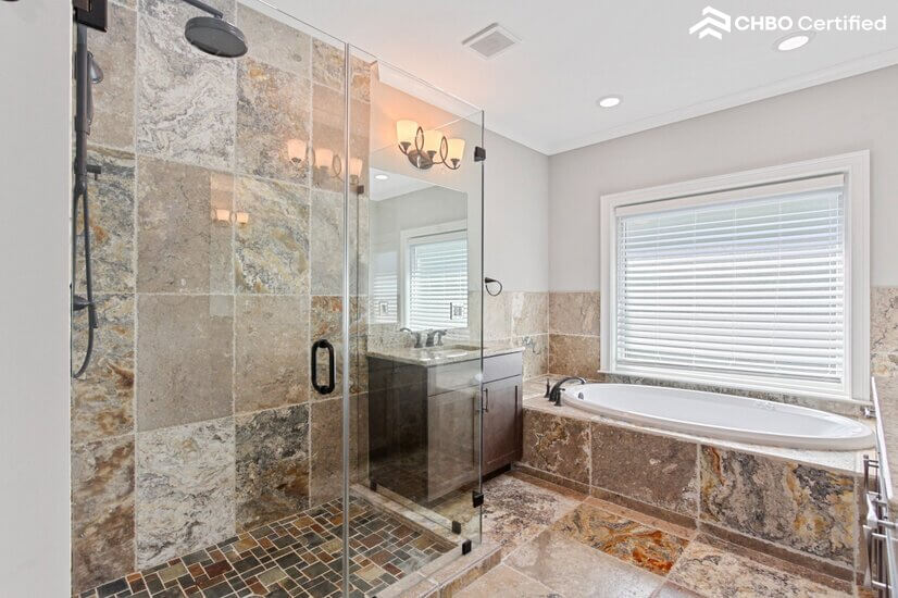 master bathroom with tavertine tiles throughout