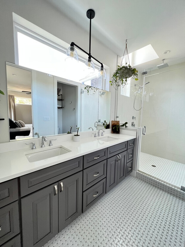 Primary Bathroom with double sinks and water