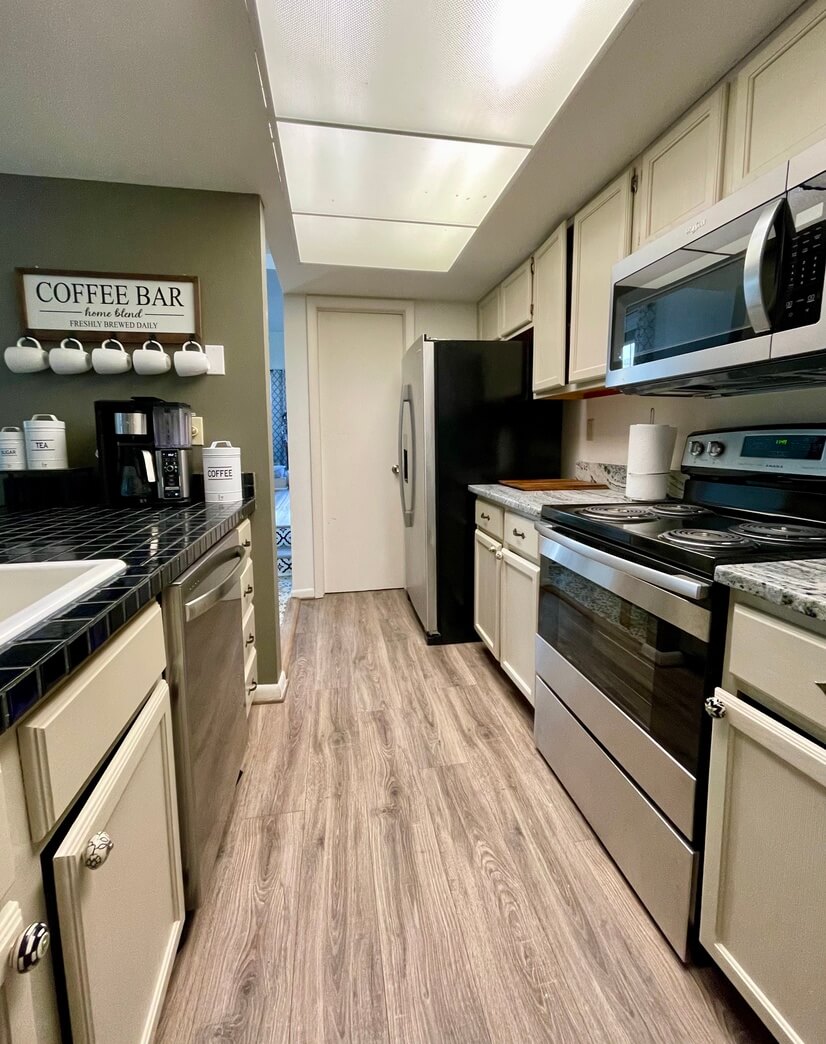 Galley style kitchen with new appliances