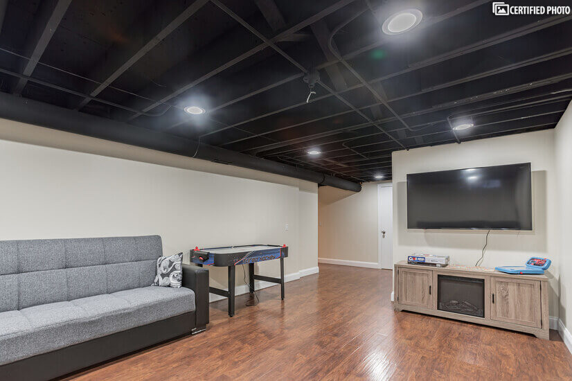 Basement Rec room with 2 sofas that fold out to full beds