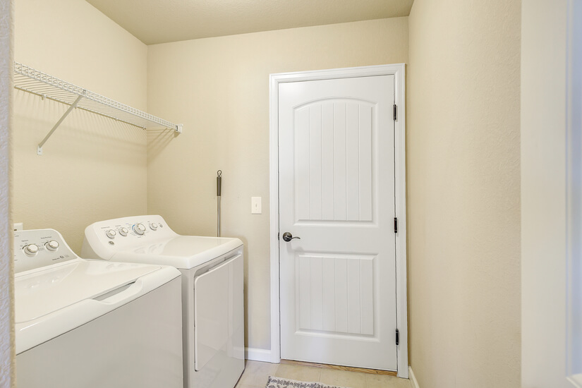 Laundry room with full size washer/dryer