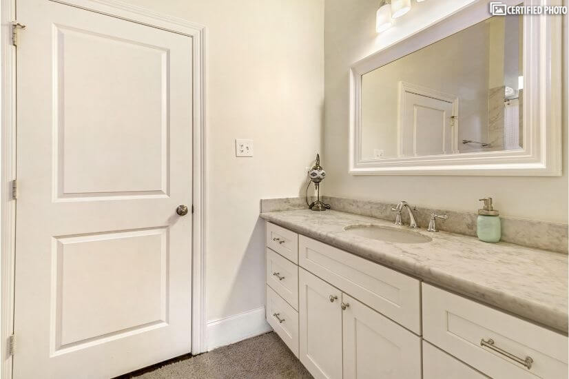 Attached bathroom with large tub and shower w
