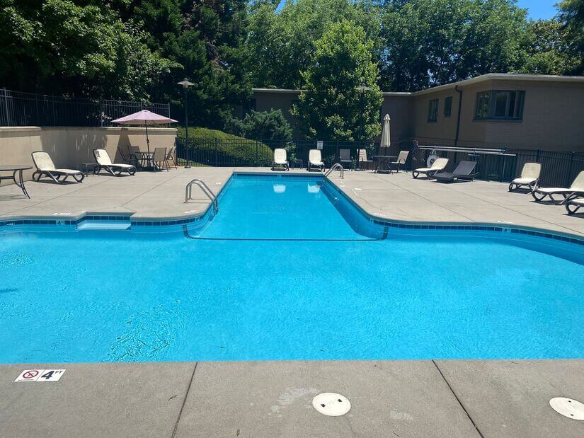 Community pool directly adjacent to apartment