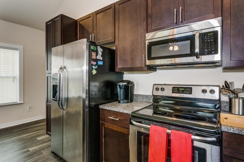 kitchen with upgraded appliances and granite