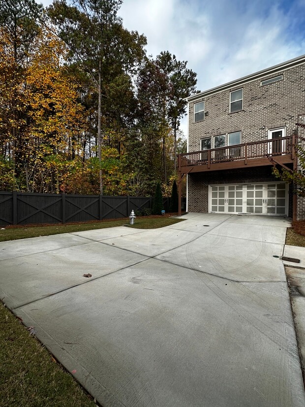 Back of home and expanded driveway
