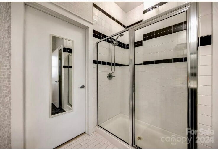 Large tiled shower w glass doors