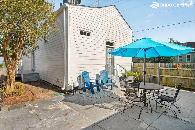 Outside patio area with patio table and additional 2 chairs.