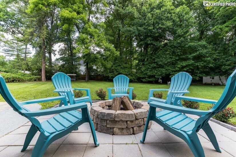 Firepit overlooks large 1 acre fenced in yard.