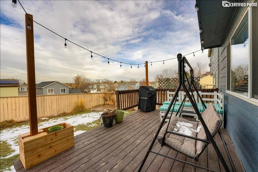 backyard porch with entertaining space, grill