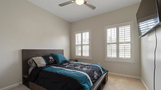 Cozy bedroom with TV, walk in closet and ligh