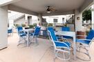 Covered Patio with mini fridge and grill at t