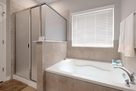 Master bath with walk-in shower and soaking t