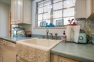 Kitchen has color coordinated beyond.
