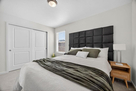 Queen size bed with spacious closet.