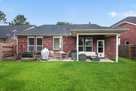 Open backyard with covered back patio