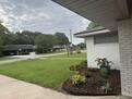 Front yard view. Long driveway