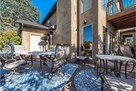 Family room deck wraps around back of home w/
