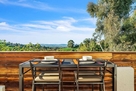 Outdoor dinning surrounded by lush green view