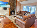 Cozy family room, fireplace and TCL 65 in TV