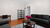 Comfortable Shared Living Room with TV and Na
