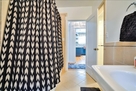 View of downstairs bathroom with 2 showers an