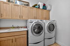 Laundry room between guest powder room and ga