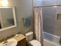 Marble walls and floor in second bath