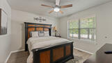 Second bedroom.  Queen bed, 60" smart TV.