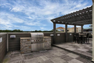 Rooftop built-in grill and shade arbor