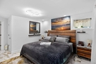 Primary: King bed w/ 4 device charging statio