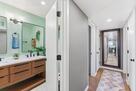 Hallway to bathrooms and bedrooms