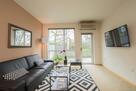 Bright, comfortable living space with patio a