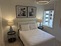 Queen Bed, beautiful artwork and headboard