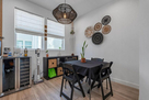 Dining nook with wine fridge and storage