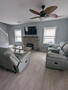 comfortable living room with electric firepla
