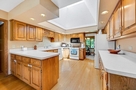 Kitchen with large skylight, capturing both m