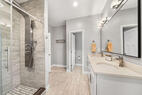 The primary suite includes dual vanities