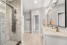 The primary suite includes dual vanities