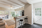 Breakfast counter looks onto sunroom