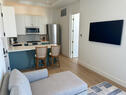 Efficient kitchenet with counter and stools