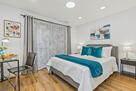 Upstairs bedroom, queen bed and desk