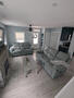 living room with wall mounted large TV
