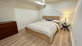 spacious bedrooms with queen bed