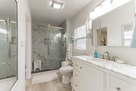 Master bathroom with large walk-in custom til