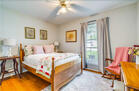 Front bedroom with Full bed, rocker & dresser