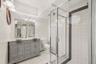 Upstairs primary ensuite bathroom with double